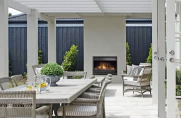 Wood outdoor fireplace in entertaining area