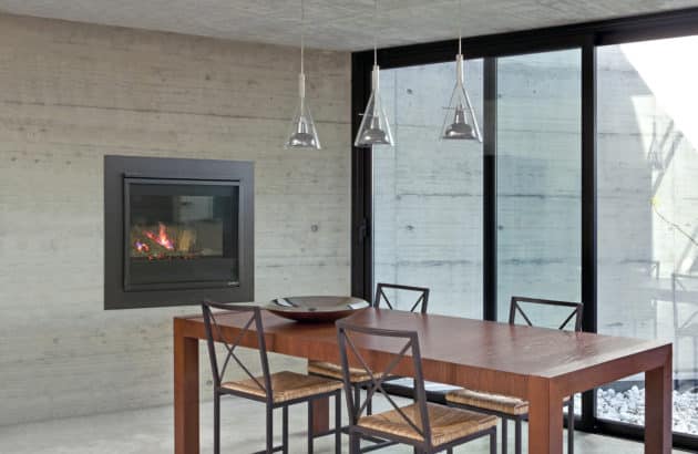balanced flue fireplace next to dining table