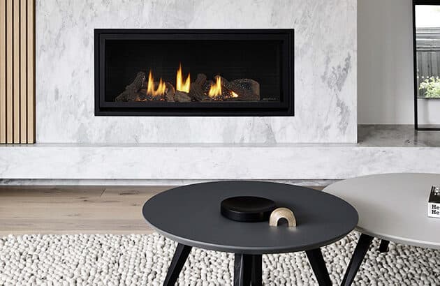 SLR-X gas fireplace in front of coffee table