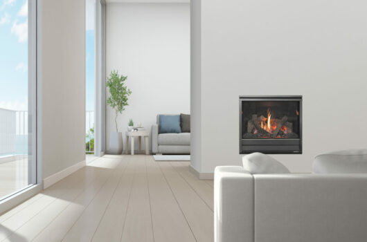 Sea view living room of luxury beach house with indoor plant near glass door and wooden floor terrace. Empty white wall background in vacation home or holiday villa.