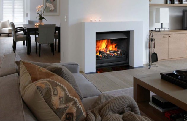 fire tools with fireplace in cosy lounge room