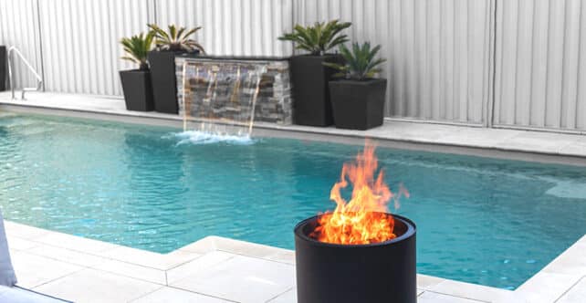 VisionLINE Outdoor Fire pit next to the pool